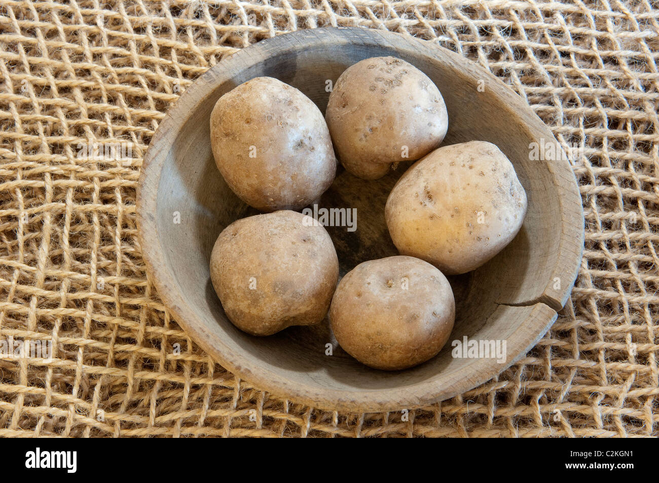 Potato (Solanum tuberosum), variety: La Bonnotte. Potatoes a wooden bowl. Stock Photo