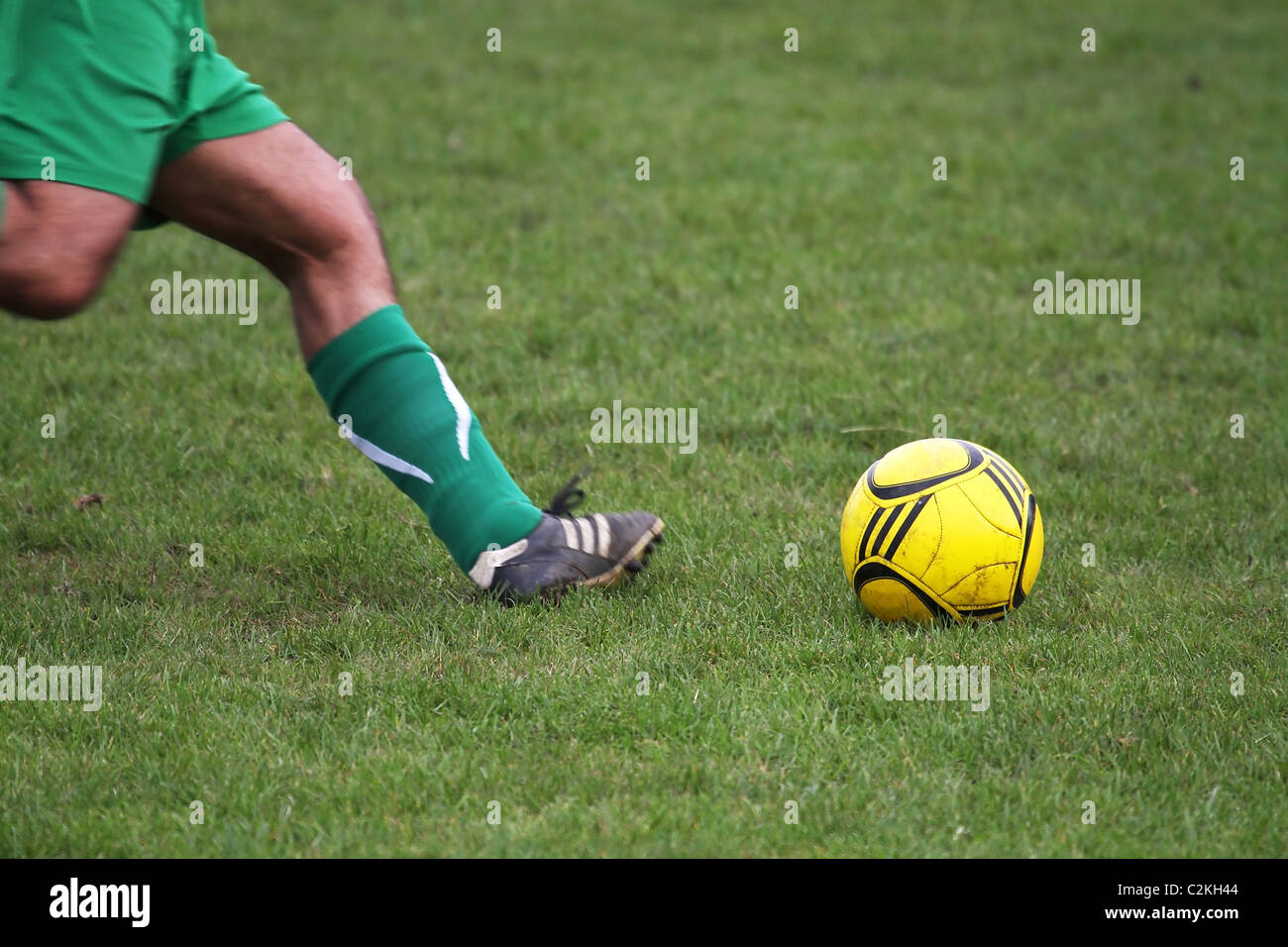 football a game of soccer a ball been kicked Stock Photo Alamy