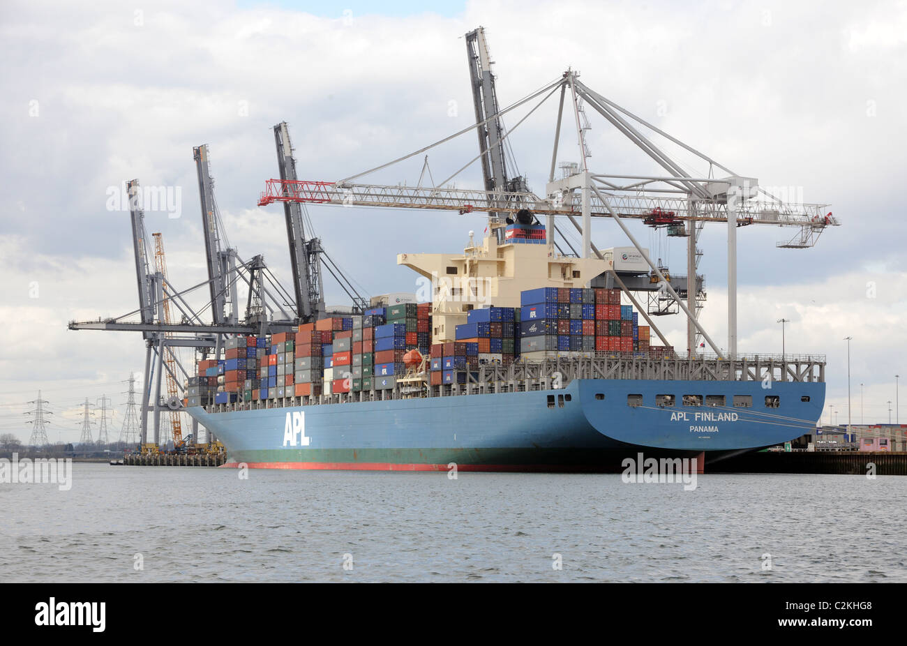 A container ship offloads containers. Import export. Stock Photo