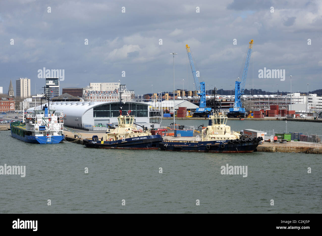 Tugboats alongside near Southampton international cruise terminal. Berth for the worlds most luxurious cruise ships. April 2010. Stock Photo