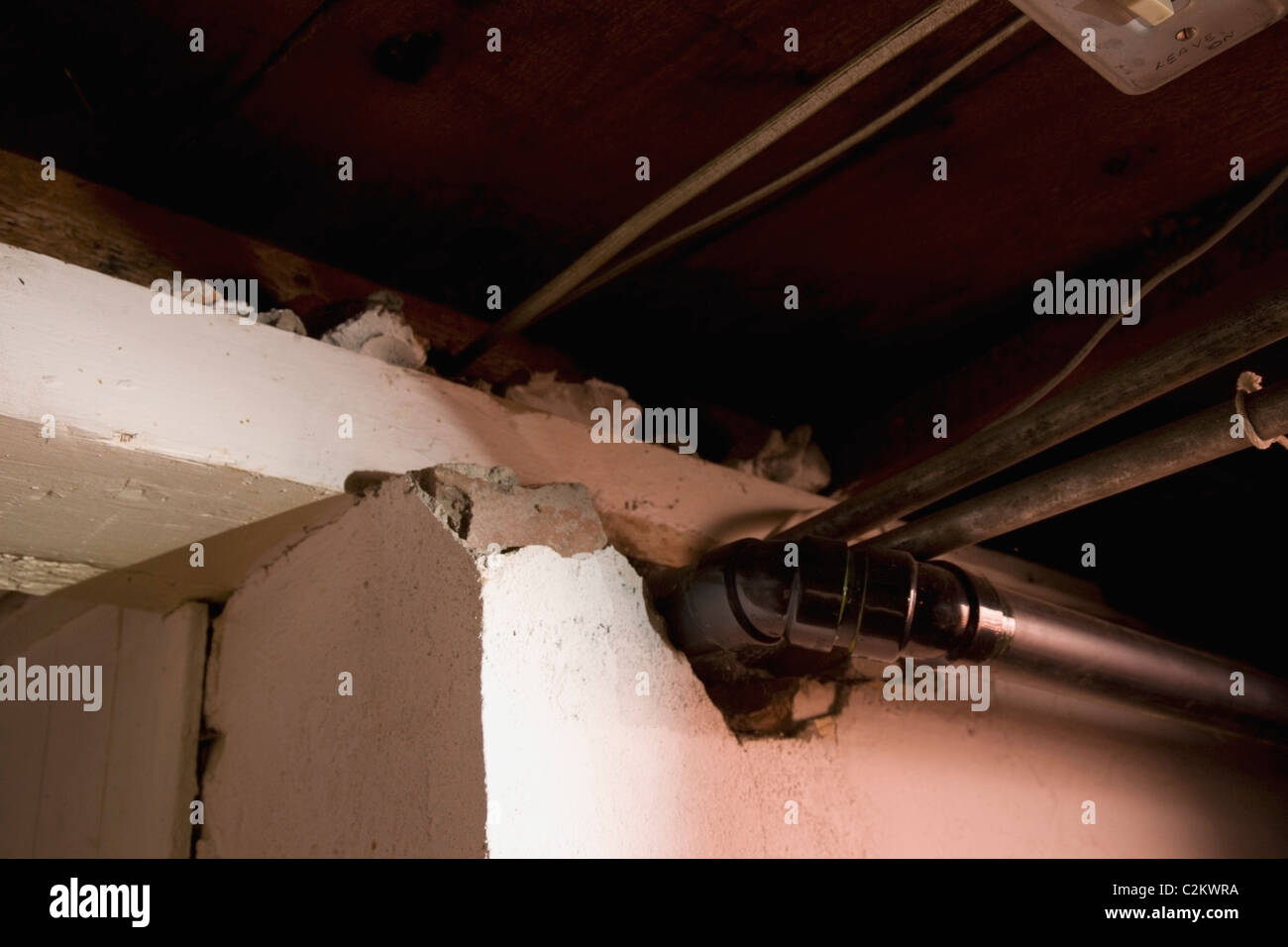 Vent And Plumbing Pipes Coming Out Of A Broken Wall Stock Photo