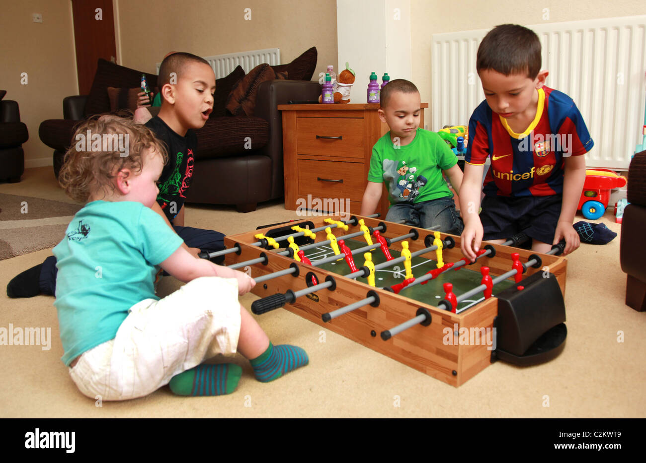 Children playing with a table top football game Stock Photo Alamy