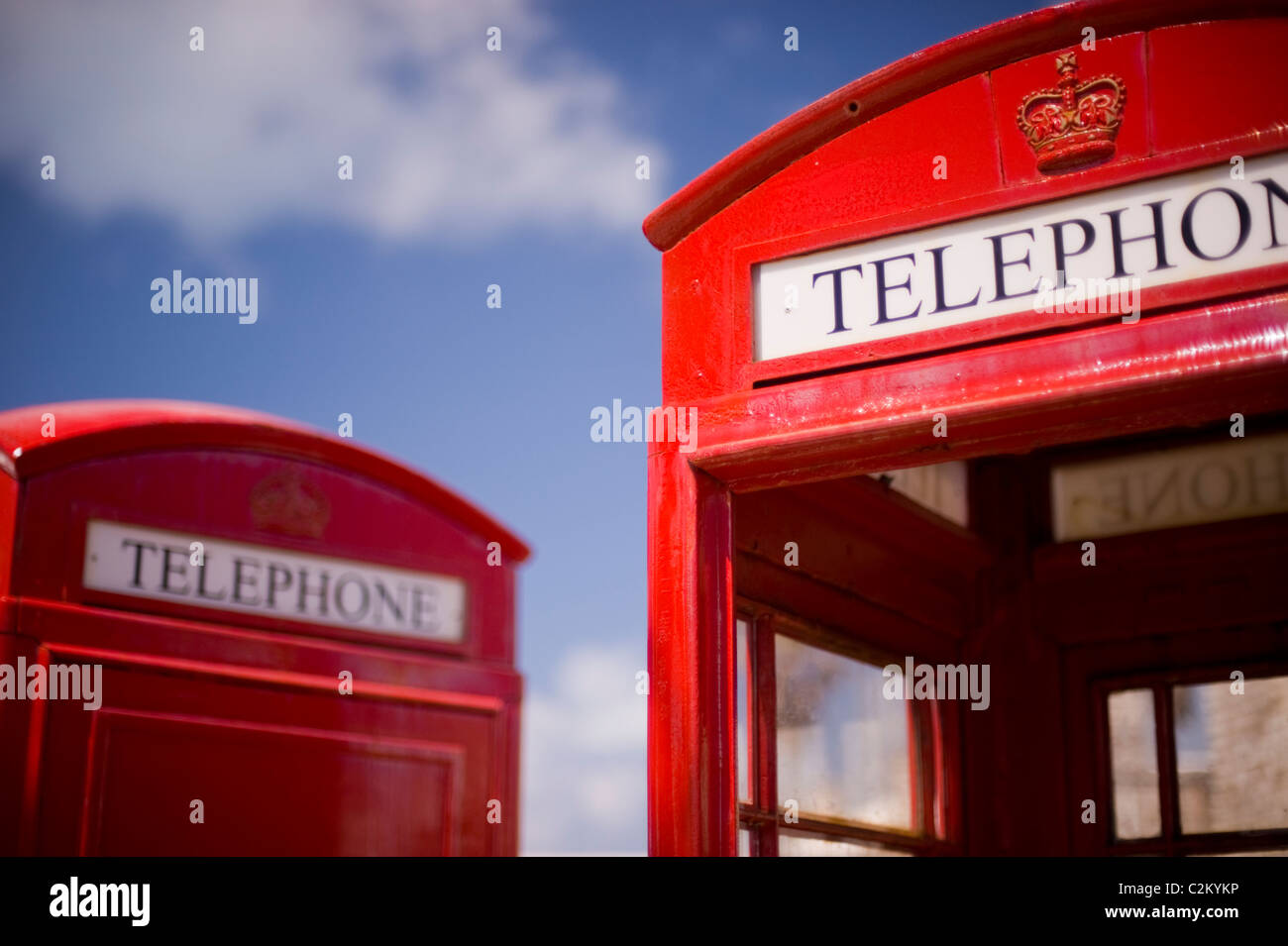 British style red telephone boxes and blue sky Stock Photo
