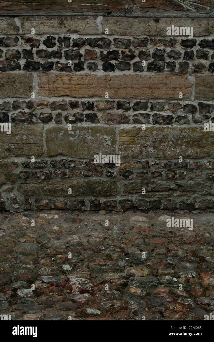 Backgrounds - detail of stratas on stone and flint wall Stock Photo