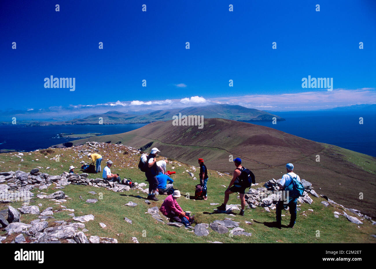 Hikers on the slopes of Slievedonagh, Great Blasket Island, County Kerry, Ireland. Stock Photo