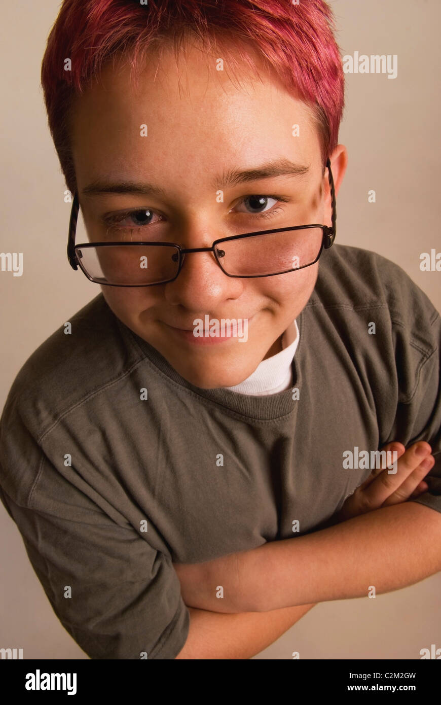 A Boy With Red Hair And Eye Glasses Sliding Down His Nose Stock Photo -  Alamy