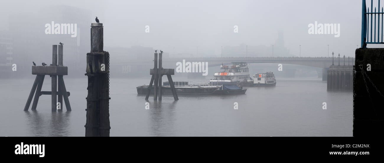 River Thames panorama, London. In fog at dawn. Stock Photo