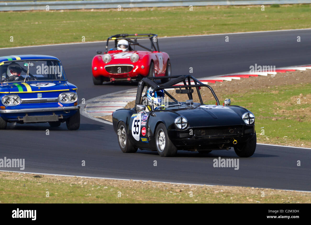 1968 Triumph Spitfire Mk3 of Steve Adams leads the NSU and Frogeye Sprite during the CSCC Swinging Sixties race, Snetterton, UK. Stock Photo