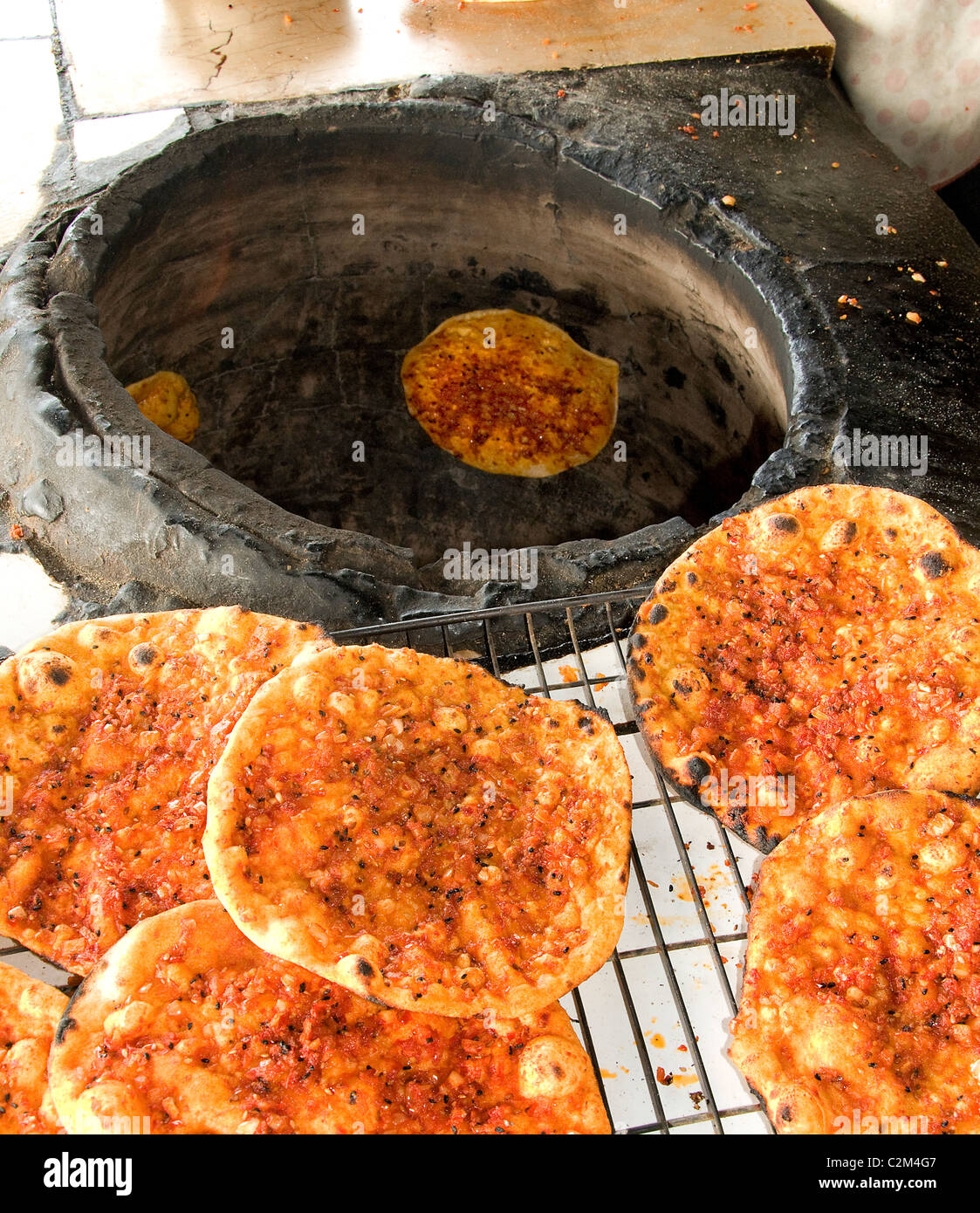 Bakery pancake pancakes pizza Syria desert Badiyat al Sham Bedouin Bedouins Villages woman Syrian Middle East Stock Photo