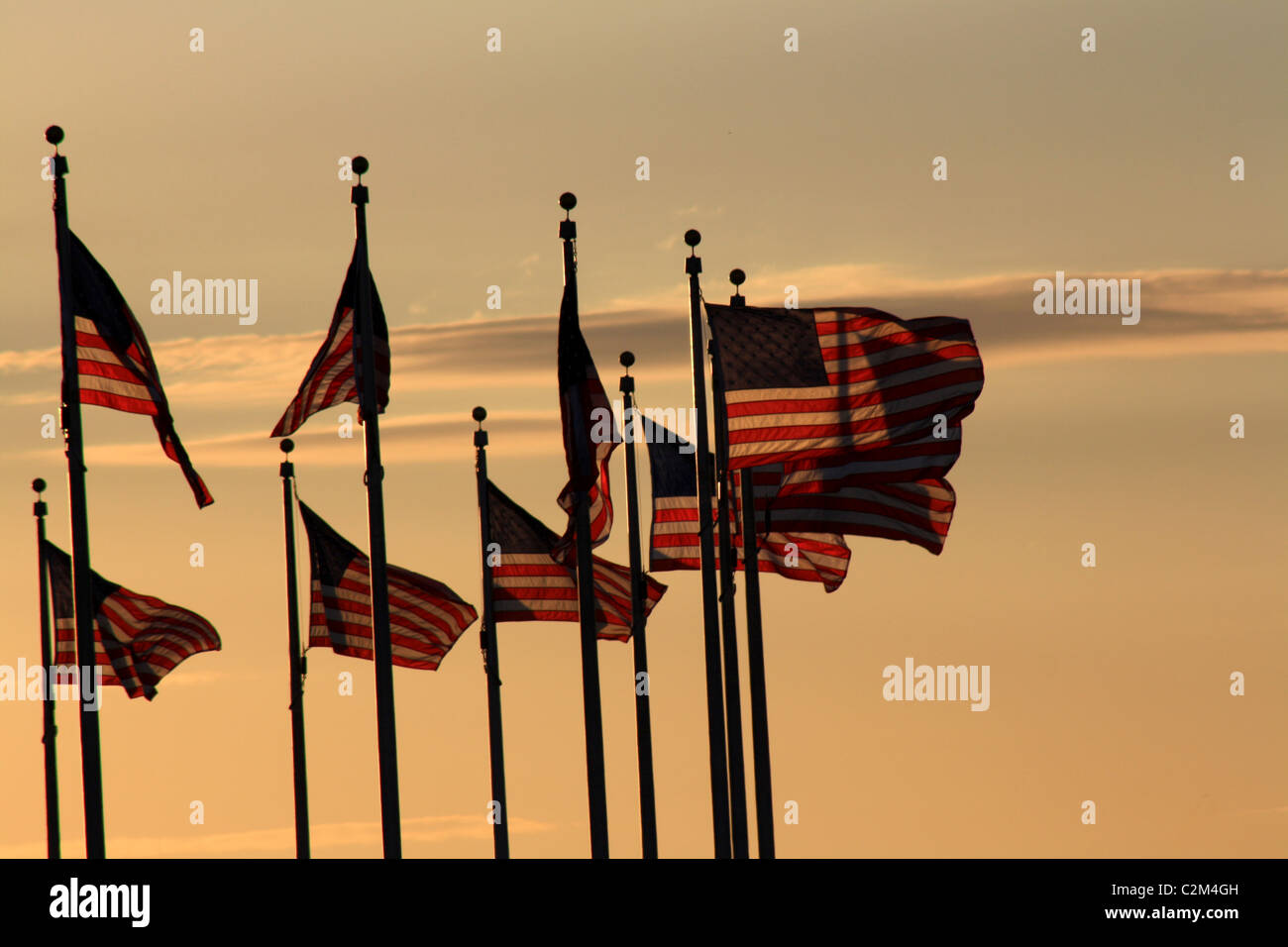 AMERICAN FLAGS AT WASHINGTON MONUMENT SUNSET WASHINGTON DC USA 12 October 2010 Stock Photo
