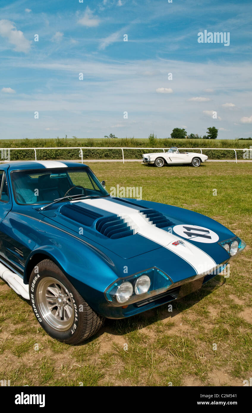 Two classic Corvette sports cars parked on a race course. Stock Photo