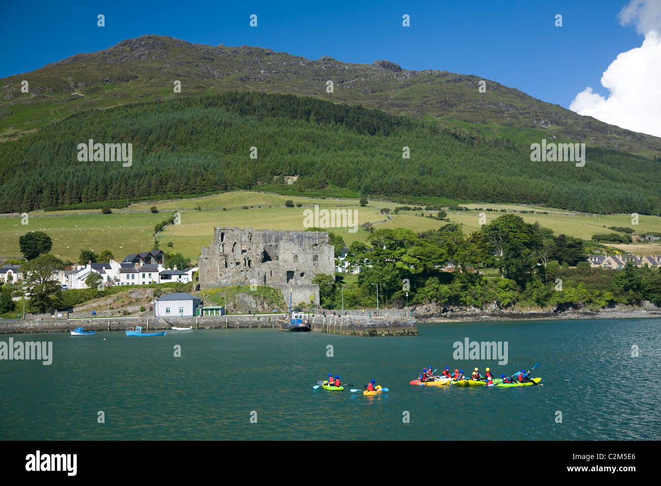 Sea kayaking group in Carlingford Lough, beneath Slieve Foy. County Louth, Ireland. Stock Photo
