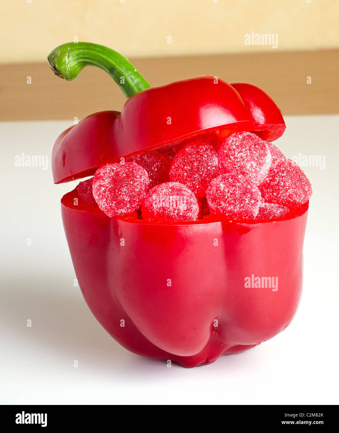 a pepper fruit filled with red jelly candy Stock Photo Alamy