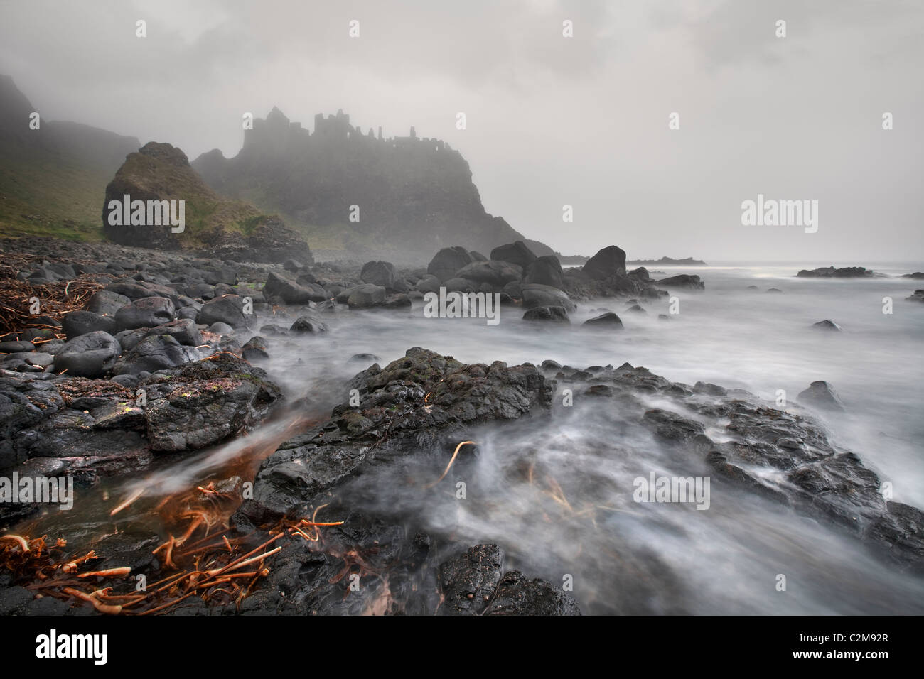 Mist of Time, Dunluce Castle captured in foggy conditions. Stock Photo