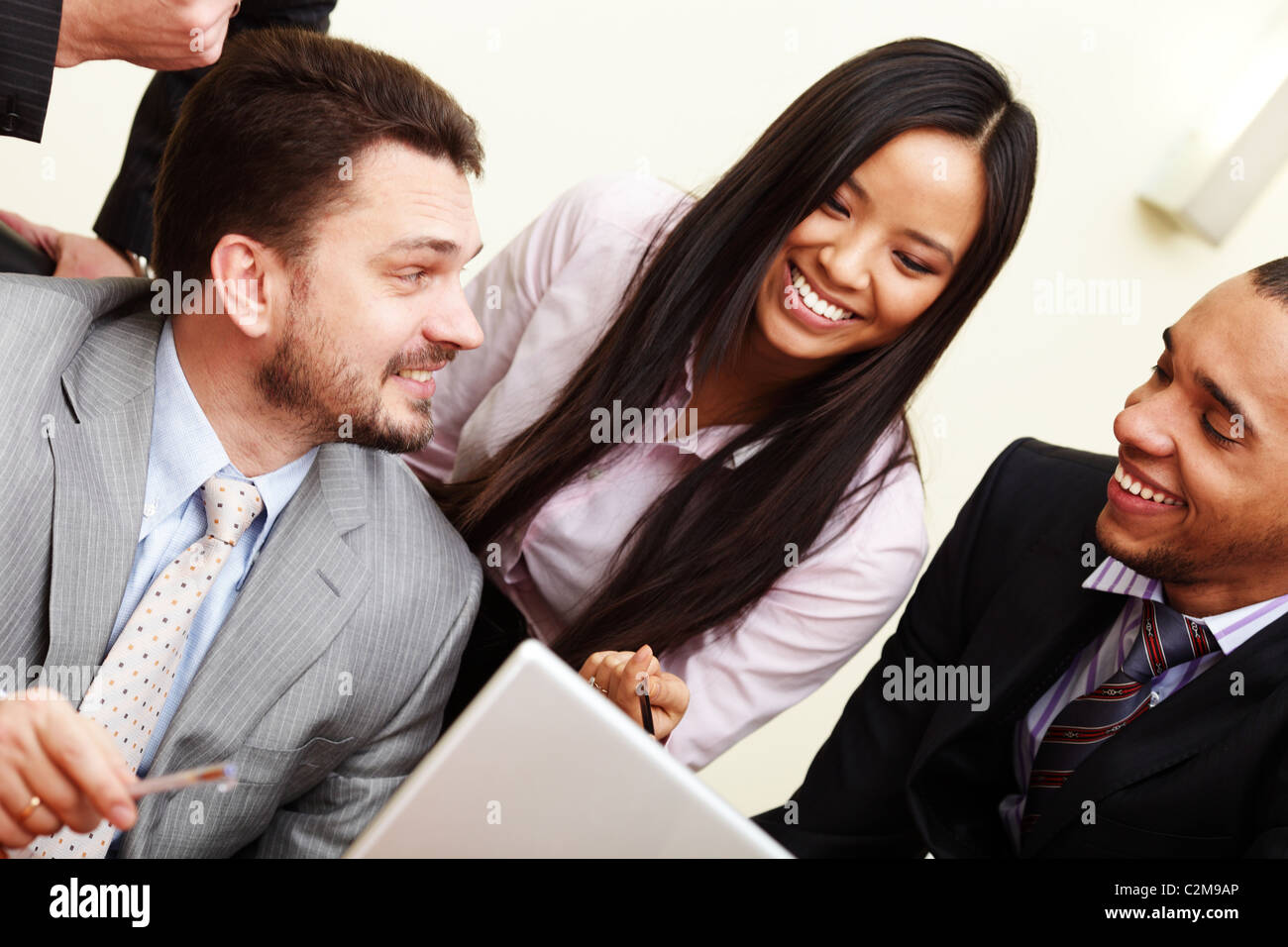 Multi ethnic business team at a meeting. Interacting. Stock Photo