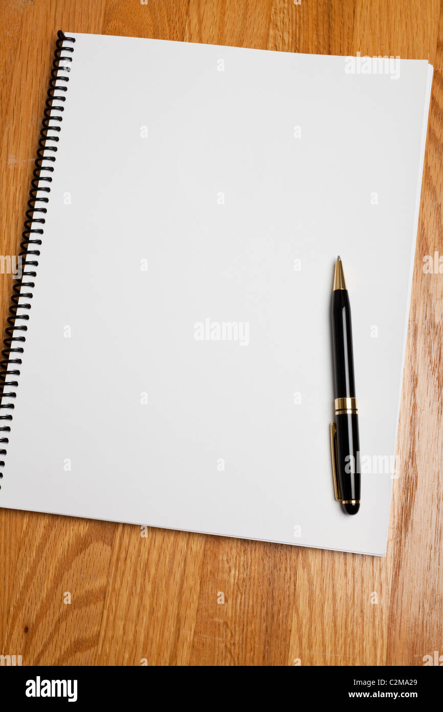 White book and wood tabletop Stock Photo