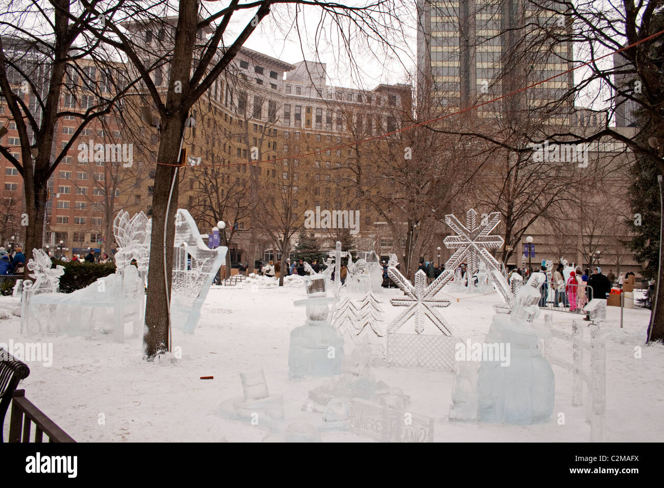 Ice sculptures in Rice Park during Winter Carnival with St Paul Hotel in background. Winter Carnival St Paul Minnesota MN USA Stock Photo