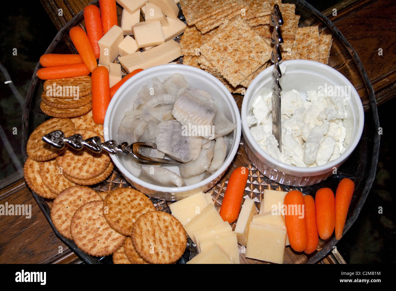 hors d'oeuvres crackers cheeses carrots herring snack tray. Cable Wisconsin WI USA Stock Photo