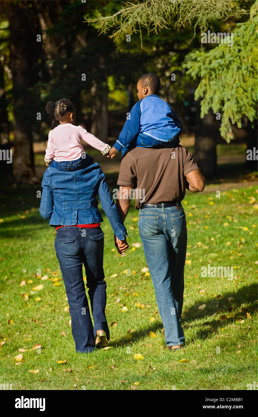 Family Walking Hand In Hand Stock Photo