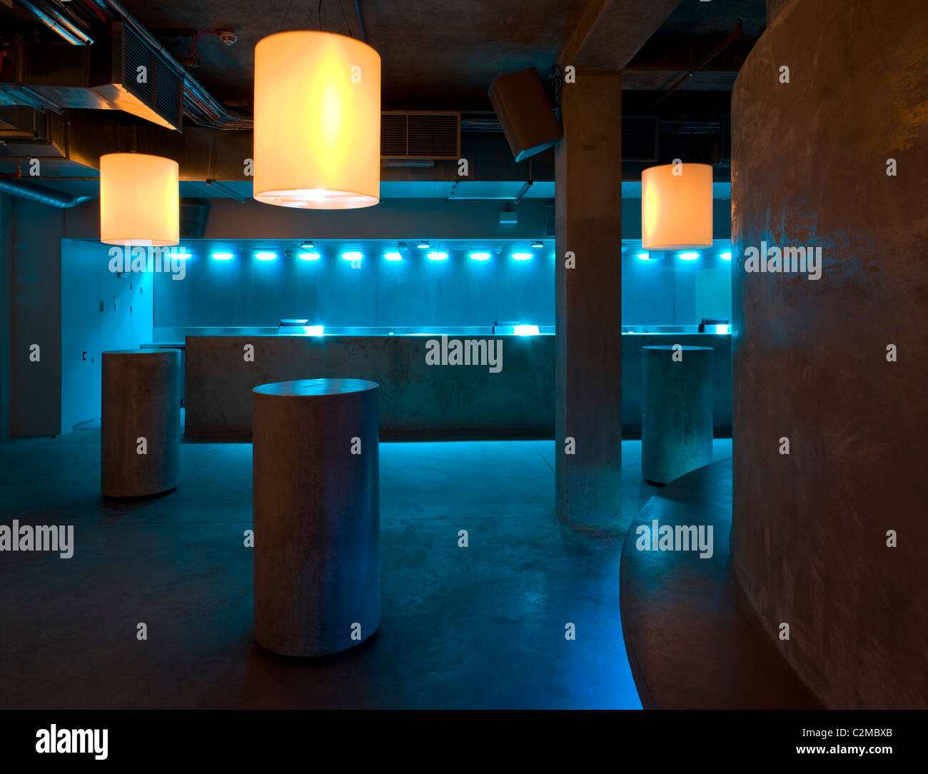 Matter, The O2 Arena, Peninsula Square, London. drum tables of concrete and bar Stock Photo Alamy