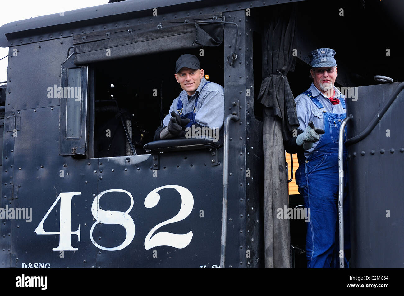 A train driver on board a steam on the railroad between