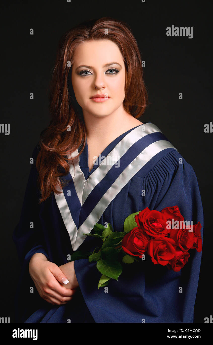 Graduate holding bouquet flowers graduation hires stock photography