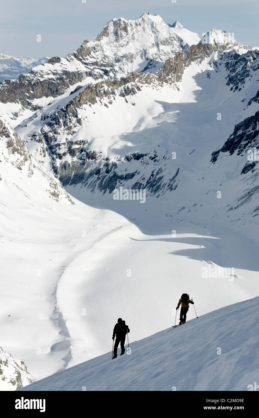Ski touring on the Pointe Marcel Kurz, above Col Collon in the Central Valais, Switzerland. Stock Photo