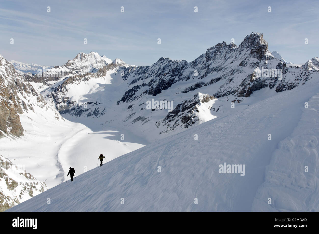 Ski touring on the Pointe Marcel Kurz, above Col Collon in the Central Valais, Switzerland. Stock Photo