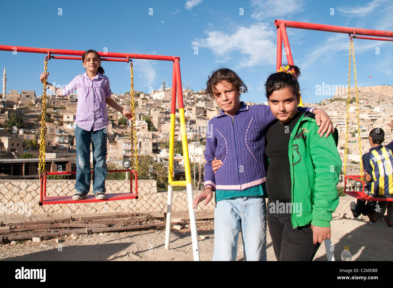Children at a playground in the Kurdish majority city of Mardin, in the eastern Anatolia region of southeastern Turkey. Stock Photo