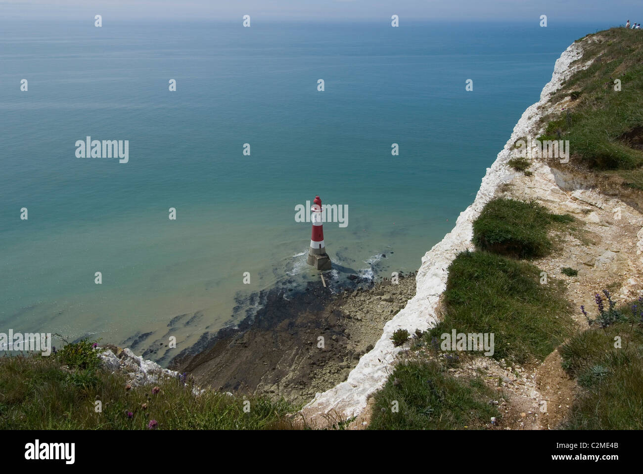 View of the lighthouse at the base of the White (chalk) Cliffs at Beachy Head, East Sussex, England Stock Photo