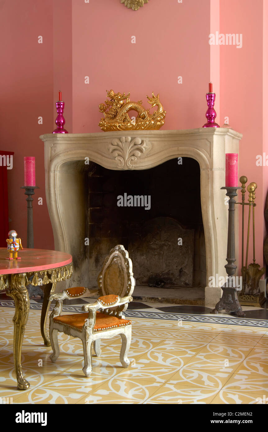 Willemijn, Haarlem. Marble fireplace surround and pink painted walls Stock Photo