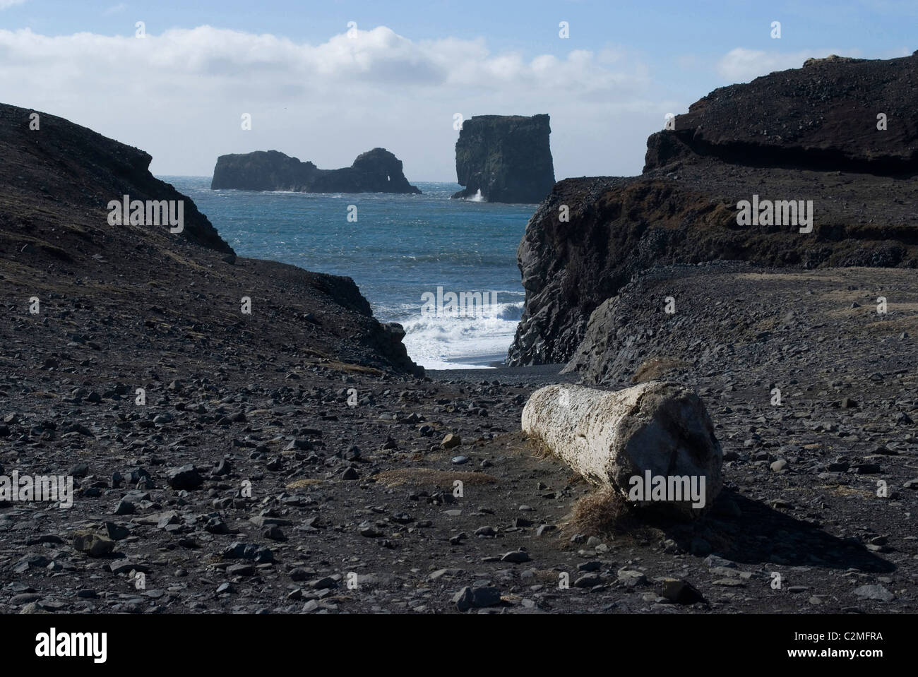 Dyrholaey cliff promontory and rock formations with black sand beach, near Vik, Southern Iceland Stock Photo