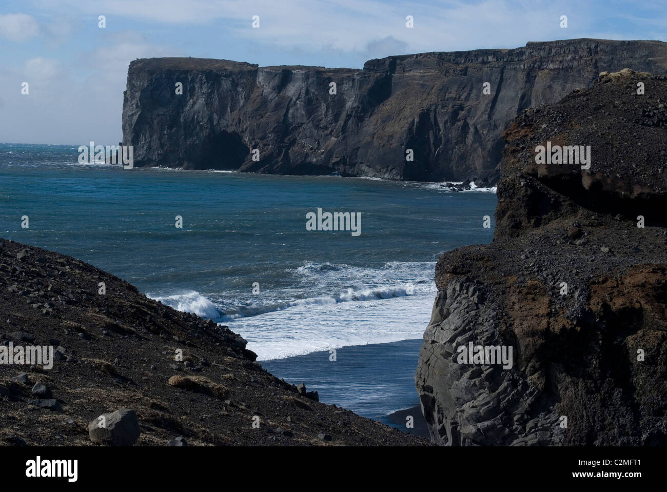 Dyrholaey cliff promontory and rock formations with black sand beach, Southern Iceland Stock Photo