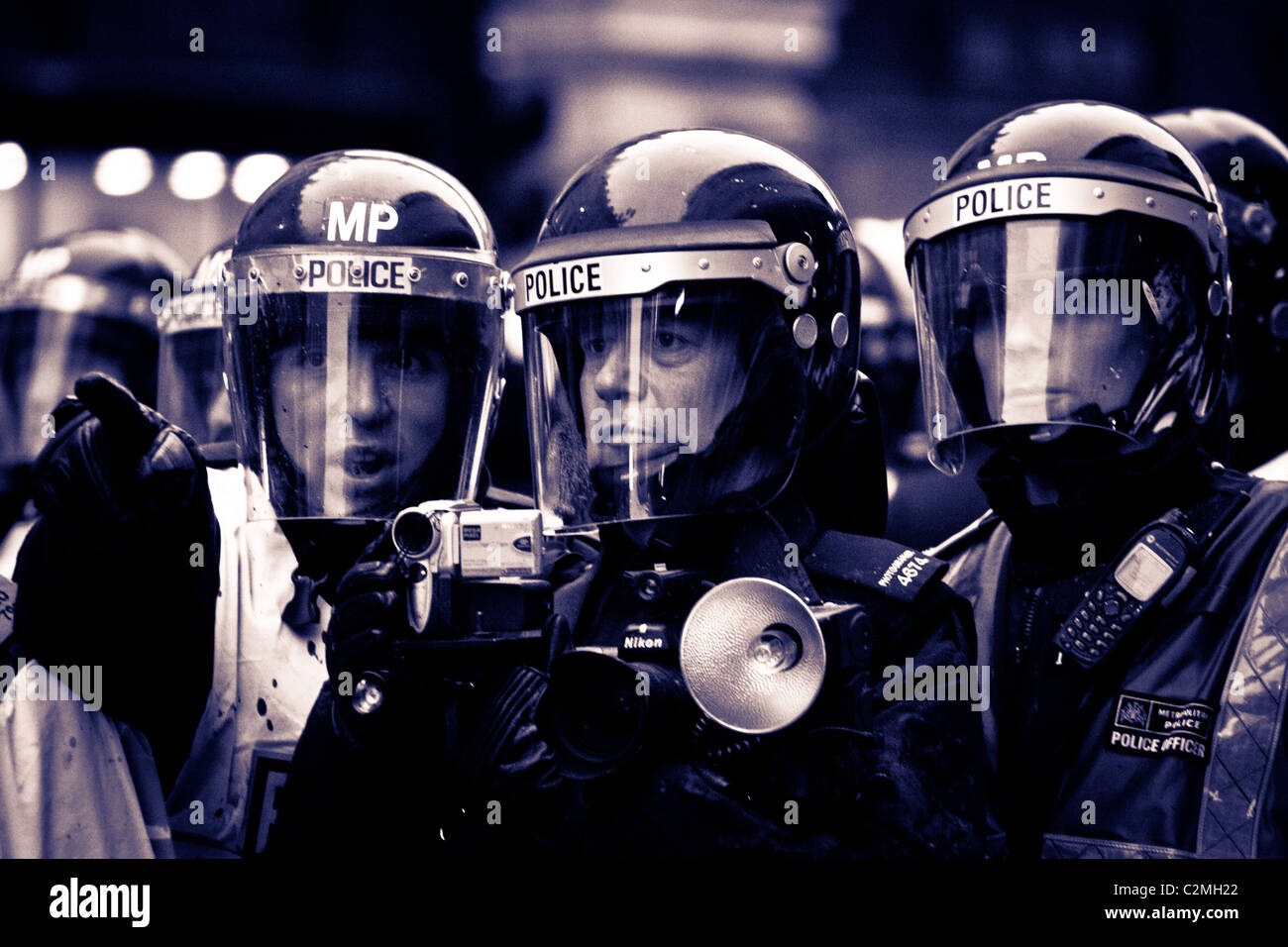 Police video surveillance team at demonstration in Central London Stock