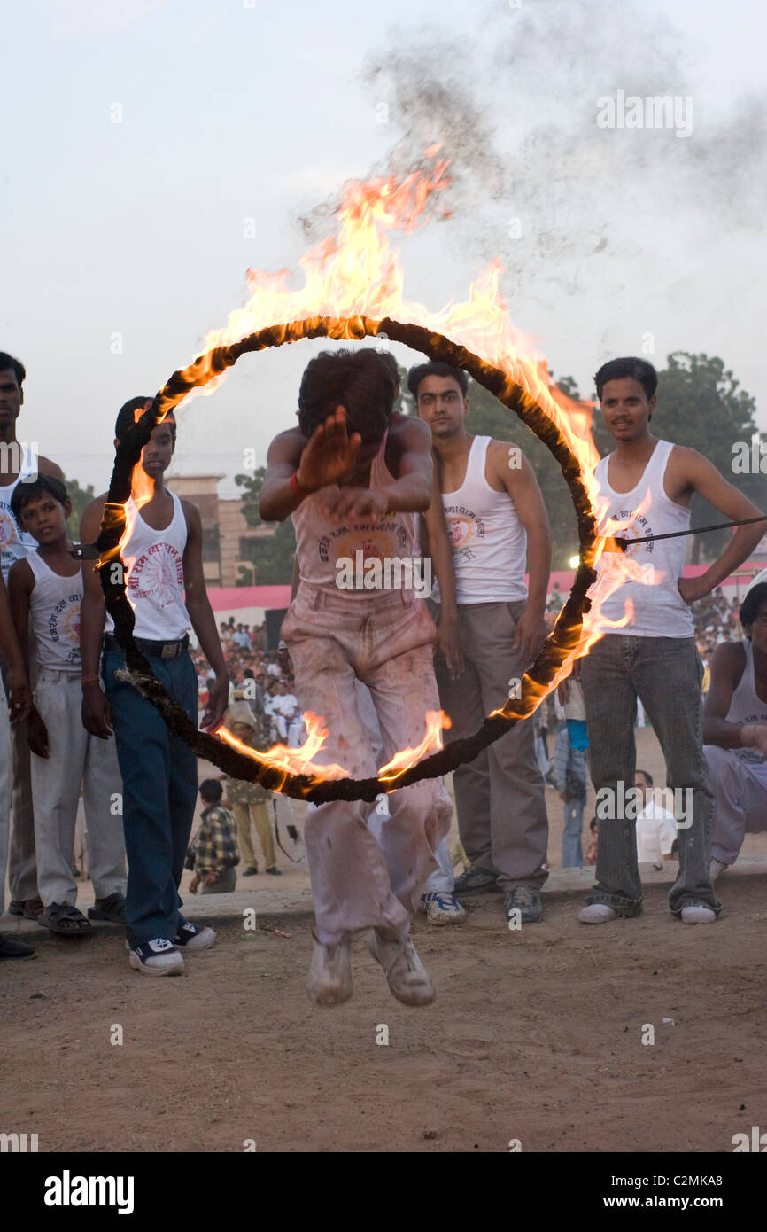 A man jumps through a ring of fire as Jodhpur celebrates Dussera ...