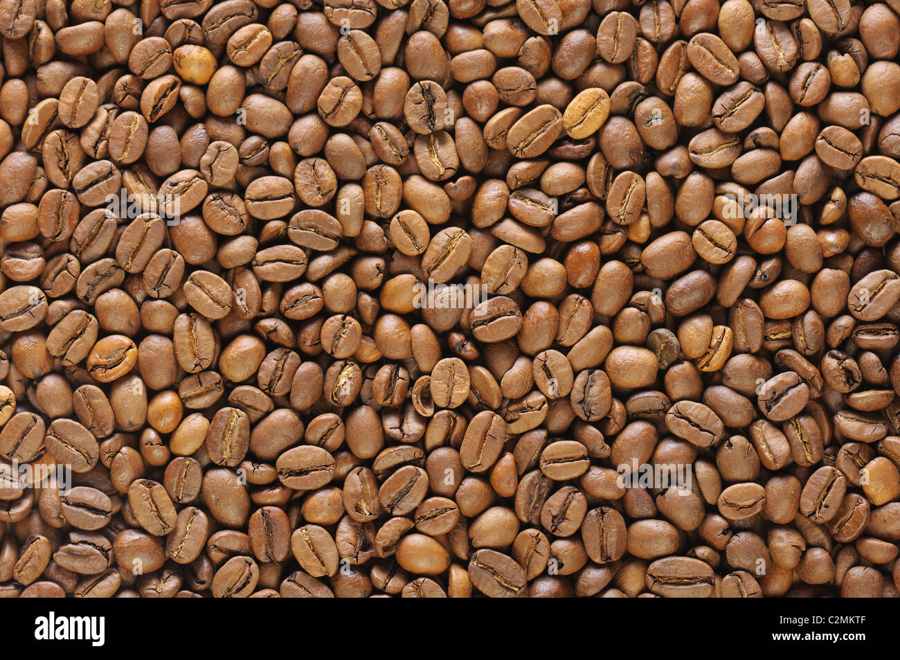 food background with brown roasted natural coffee beans Stock Photo - Alamy
