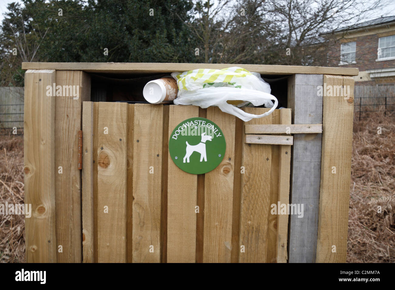 Rubbish stuck in error into a "dog waste only" bin in Richmond Park