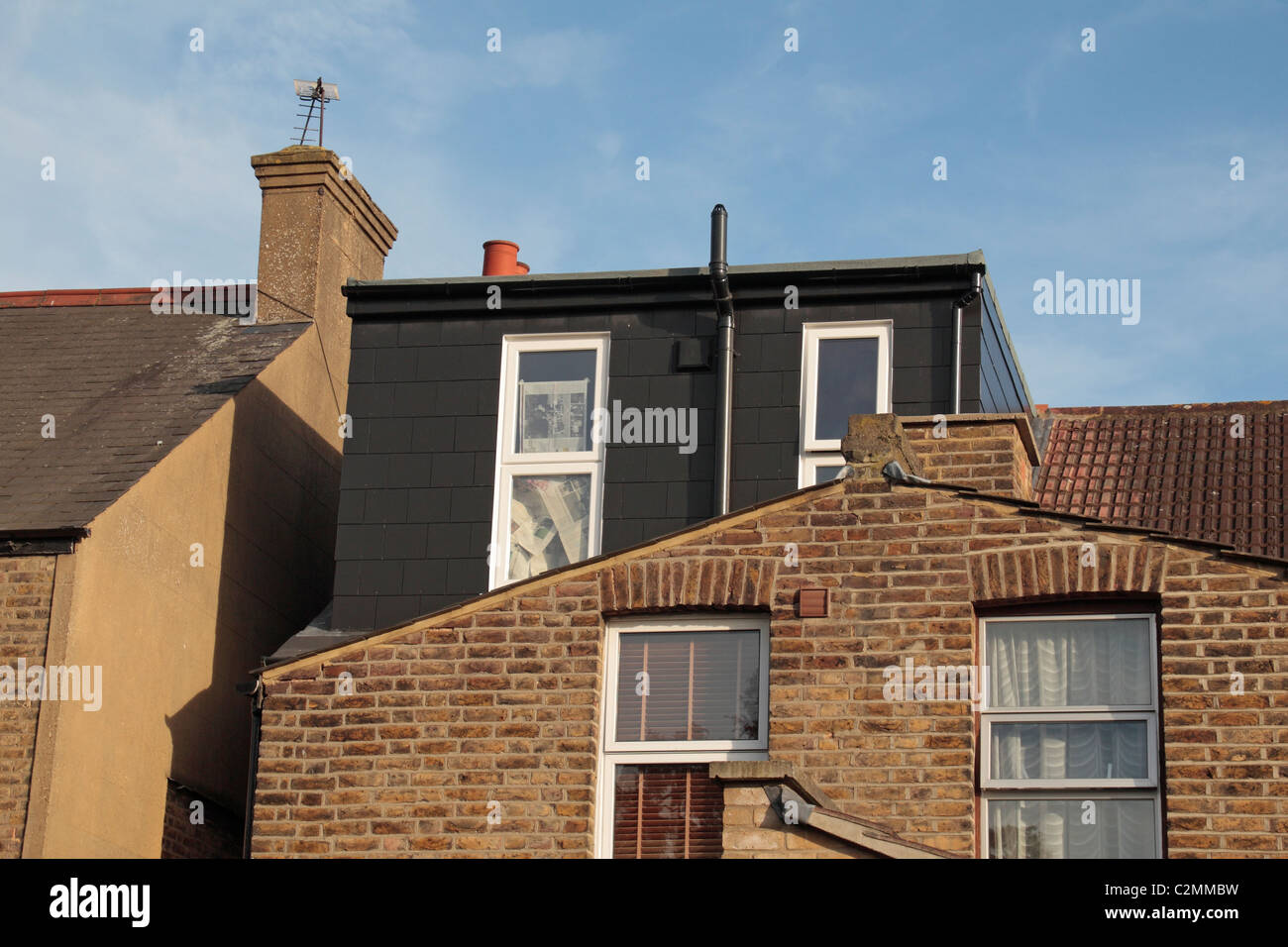 The rear view of a UK residential property (late Victorian) shortly after a roof/loft extension. Stock Photo