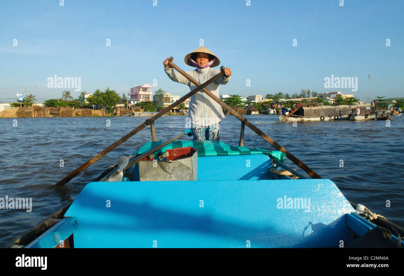 Vietnamese vendor rowing her boat at the Cai Rang Floating Market in ...