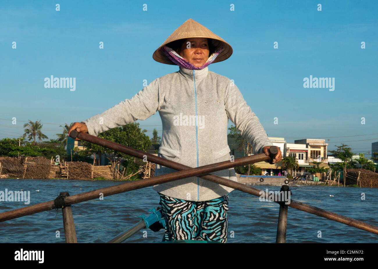Vietnamese vendor rowing her boat at the Cai Rang Floating Market in ...