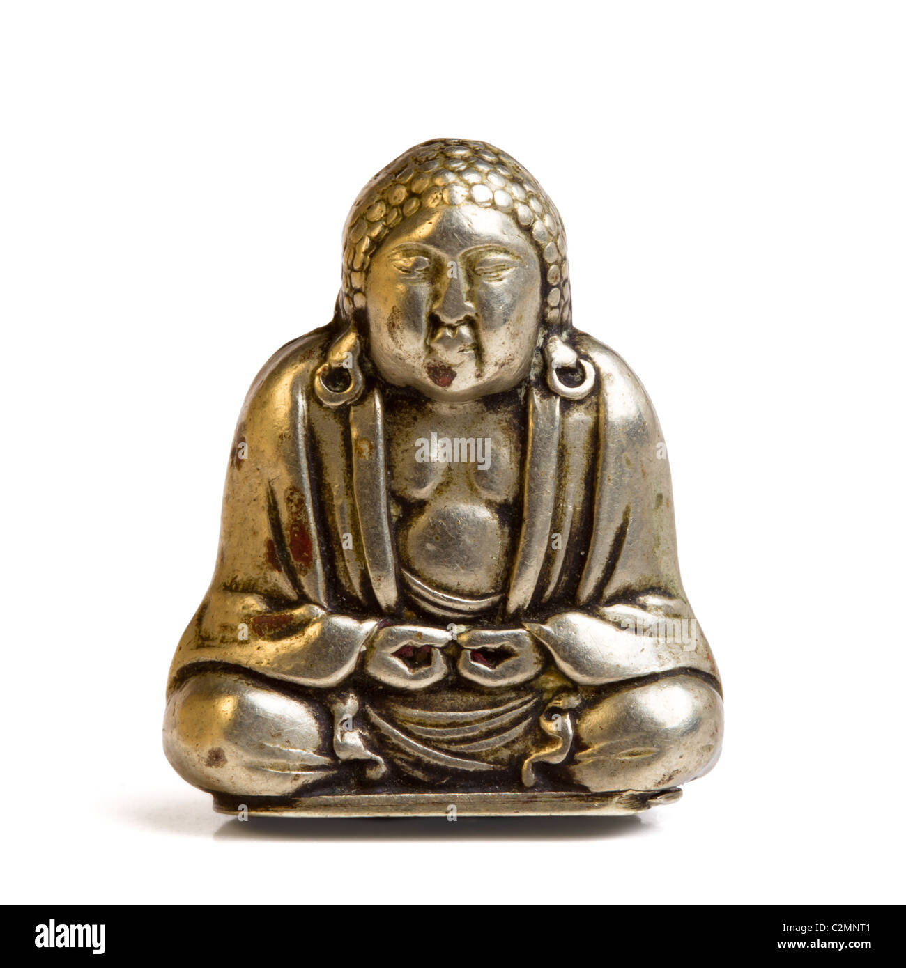Small silver Buddha isolated on white from low perspective. Stock Photo