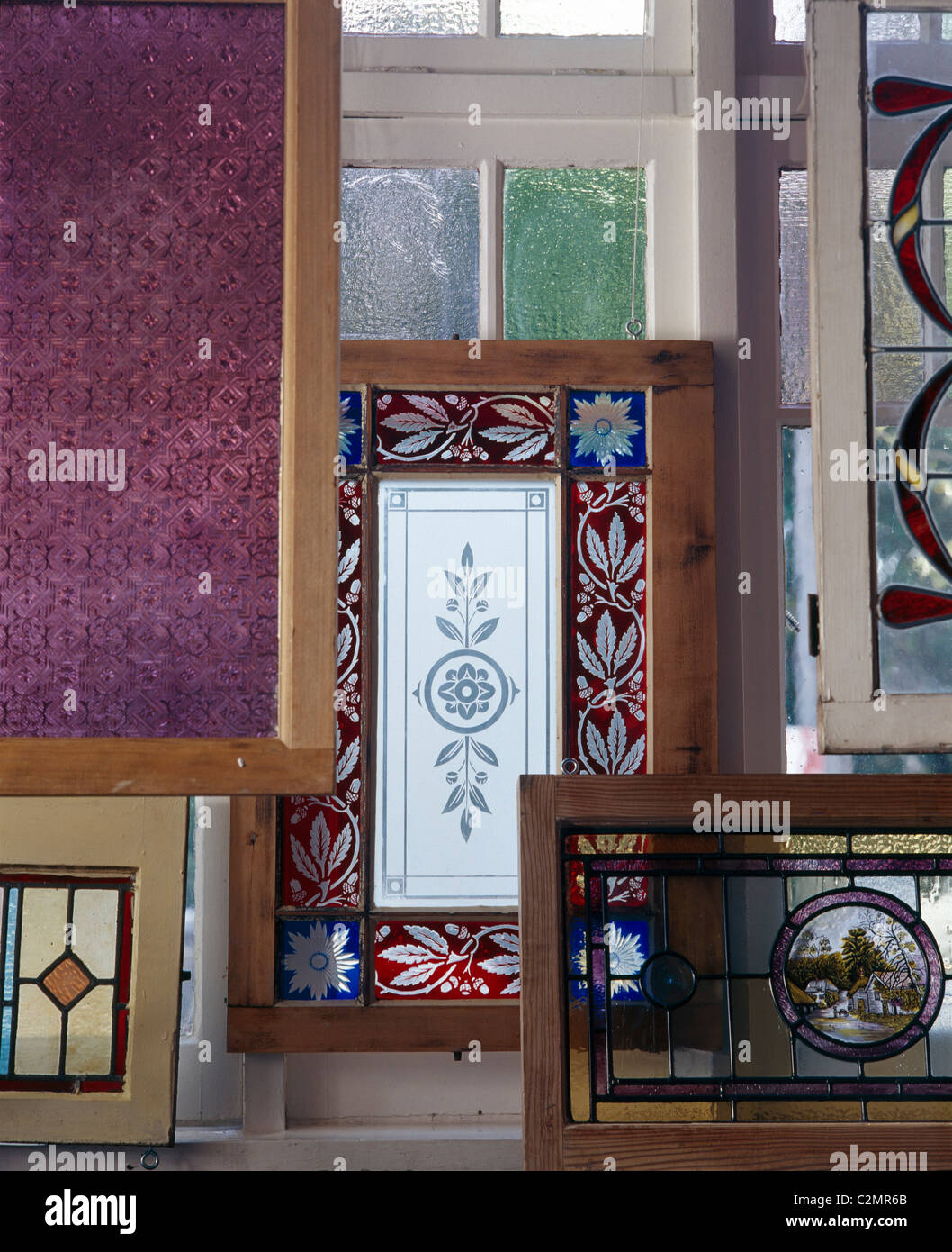 Architectural salvage yard. Various stained glass panels Stock Photo