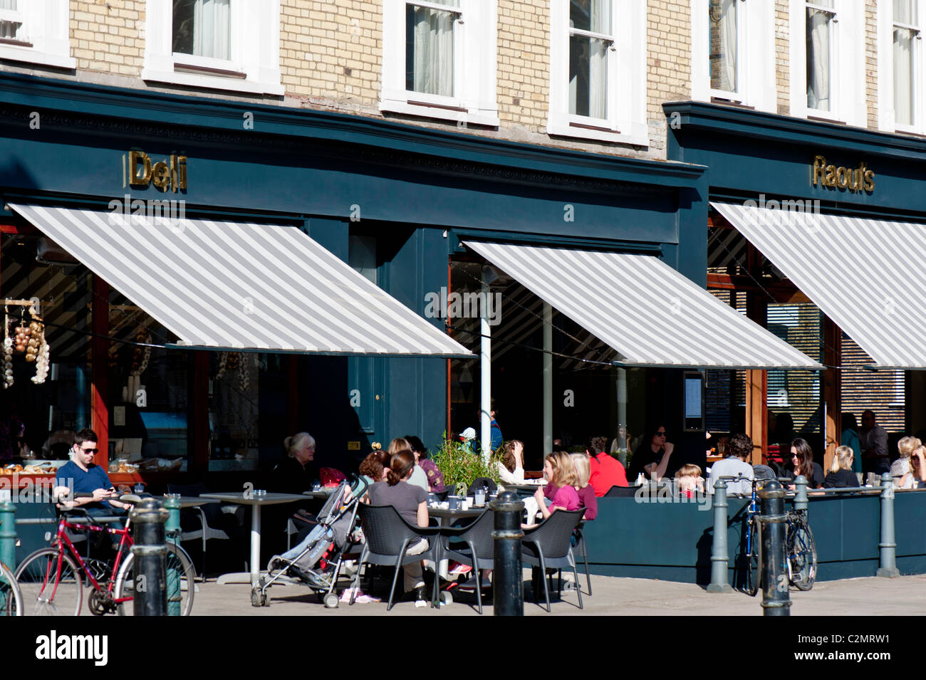 People in sidewalk cafe, Hammersmith Grove, W6, United Kingdom Stock Photo