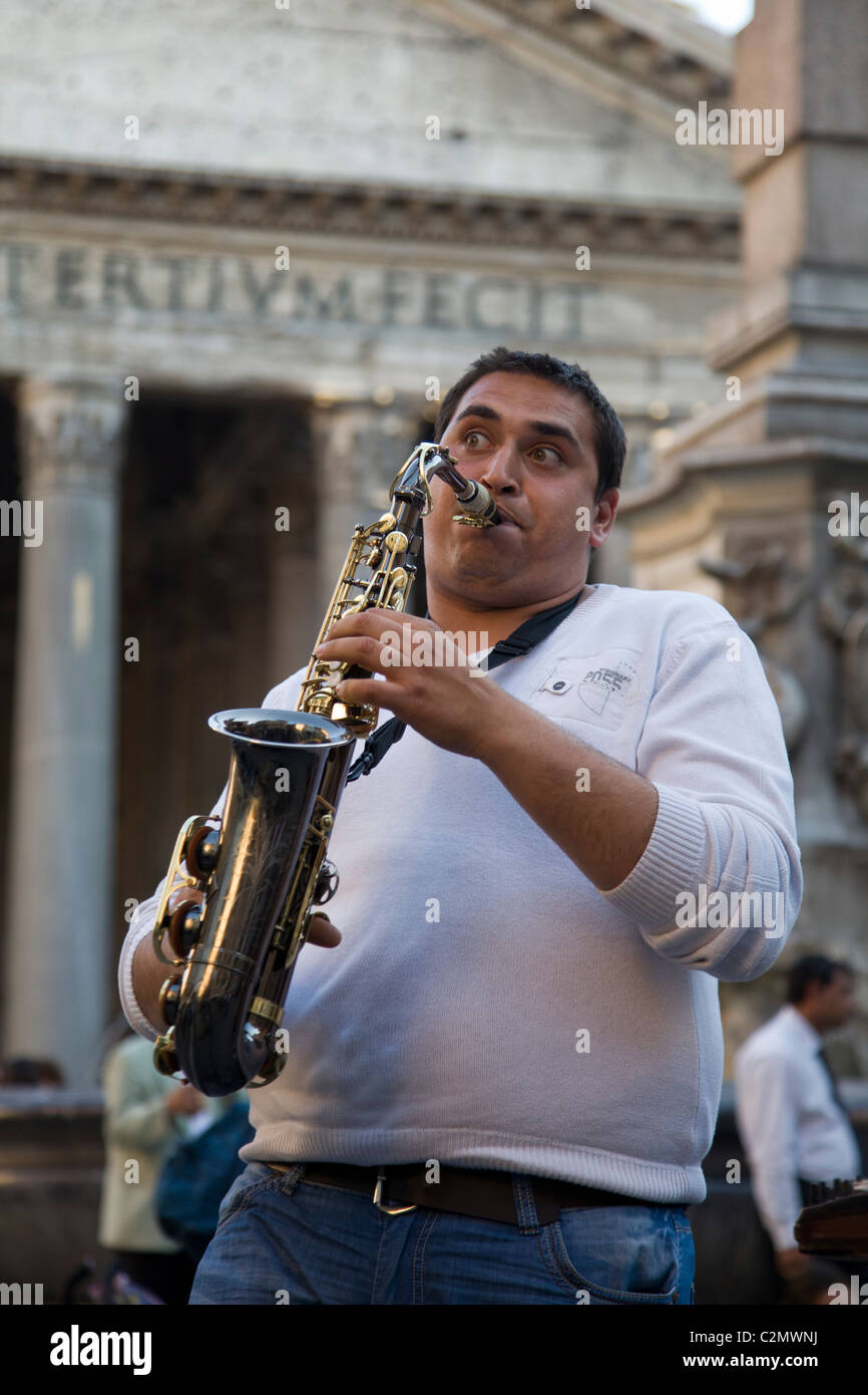 A man playing saxophone in the street of Rome, in piazza della Rotonda