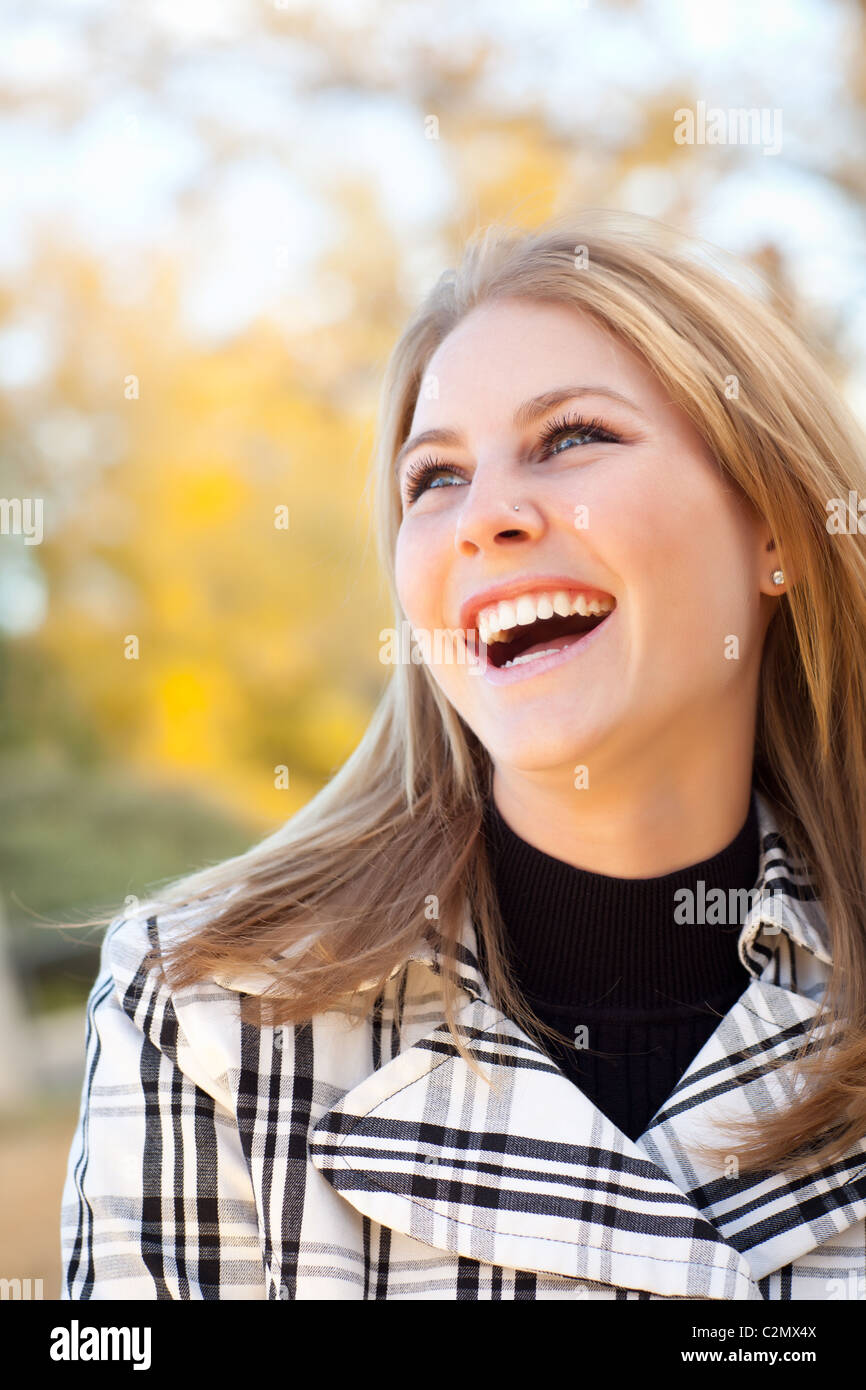 Pretty Young Woman Smiling in the Park on a Fall Day Stock Photo - Alamy