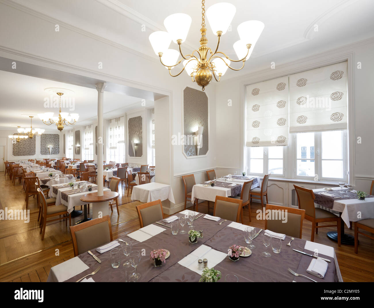The dining room tables of a restaurant (France). Salle de restaurant (France). Stock Photo