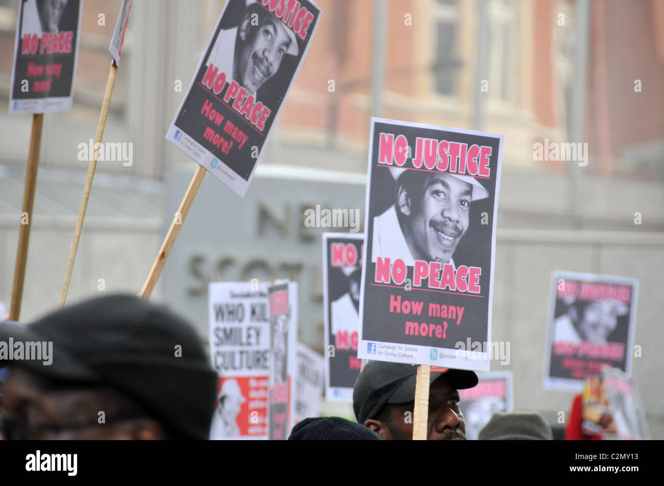 Smiley Culture Justice Peace death custody 'Death Custody' Protest Police New Scotland Yard No Justice No Peace Stock Photo