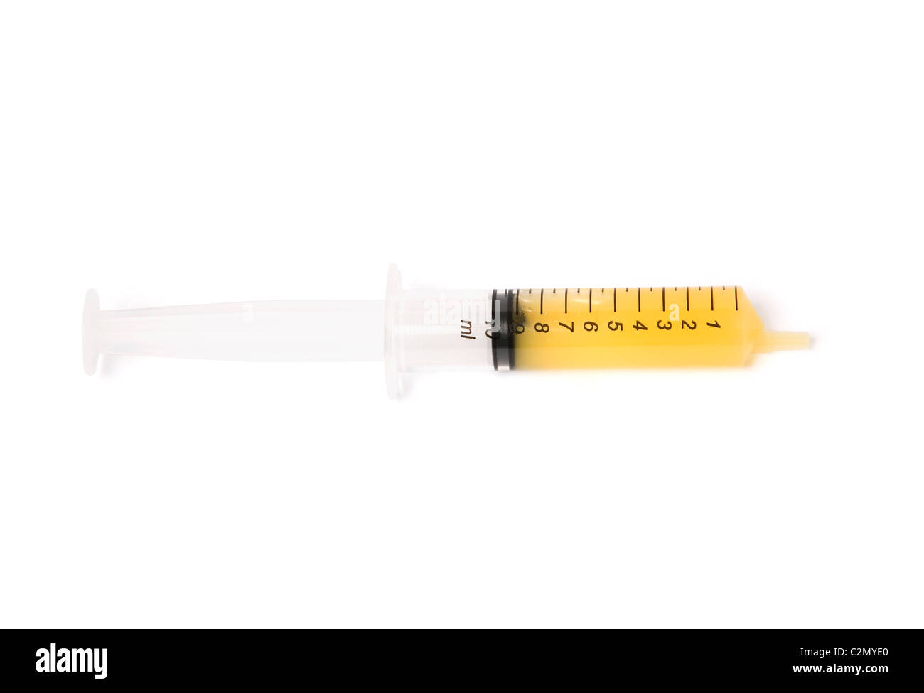 Syringe filled with orange juice vit C dose Stock Photo Alamy