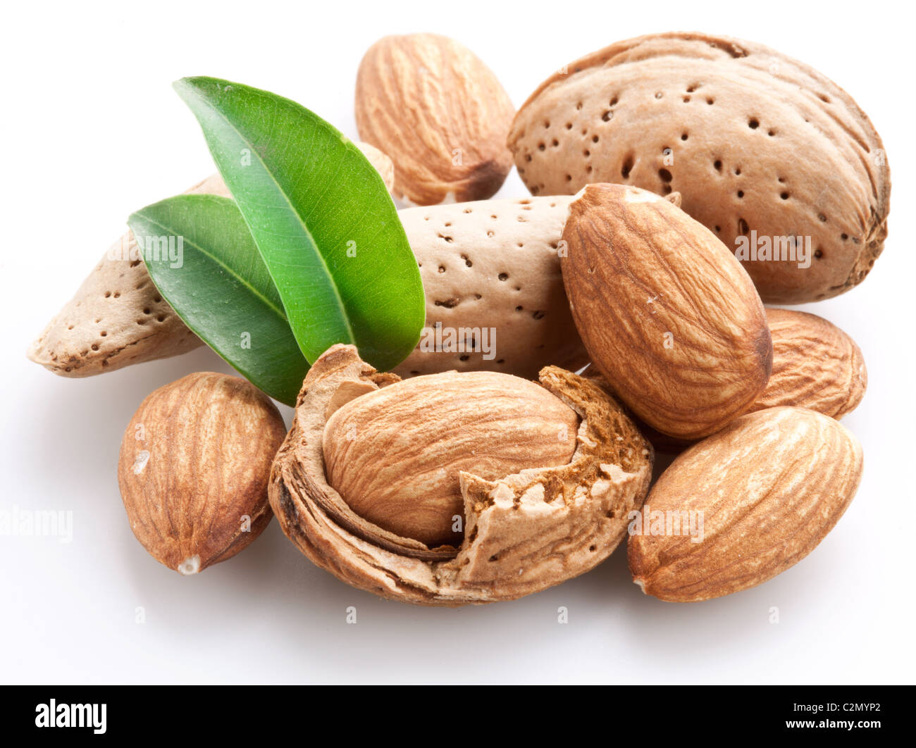 Group of almond nuts with leaves. Isolated on a white background. Stock Photo
