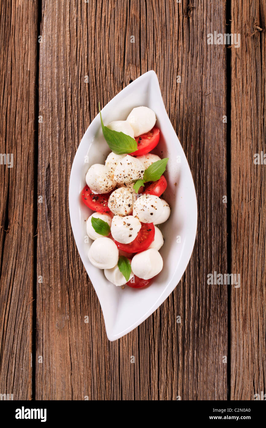Bowl of mozzarella cheese, tomato and basil Stock Photo - Alamy